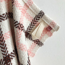 Load image into Gallery viewer, a close-up of a white, pink and brown teatowel showing the tidy hem, cotton loop and small branded tag
