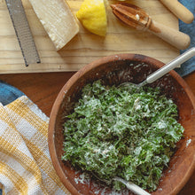 Load image into Gallery viewer, a salad in a wooden bowl sits on a table surrounded by a squeezed lemon, a block of cheese and a white and yellow teatowel
